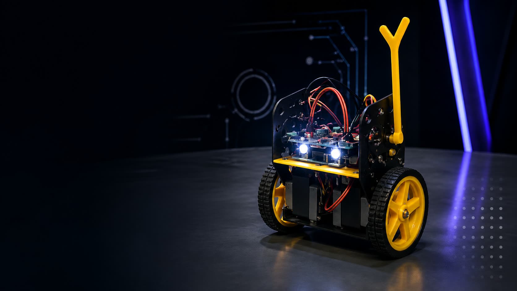 A two-wheeled AIRC research robot on a studio floor, its control boards and wiring exposed.